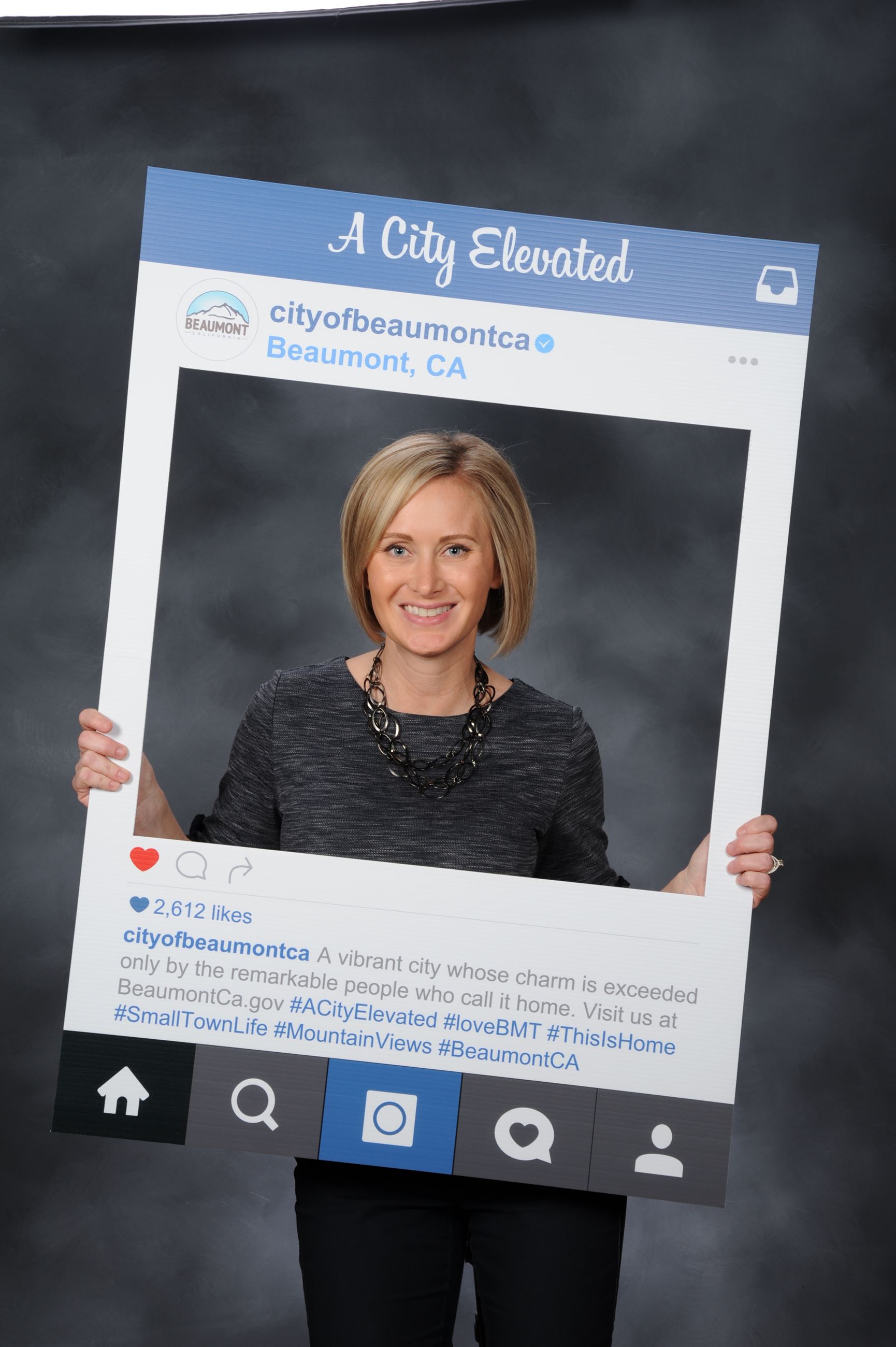 Photo of PIO Ashley Starr holding Instagram picture frame