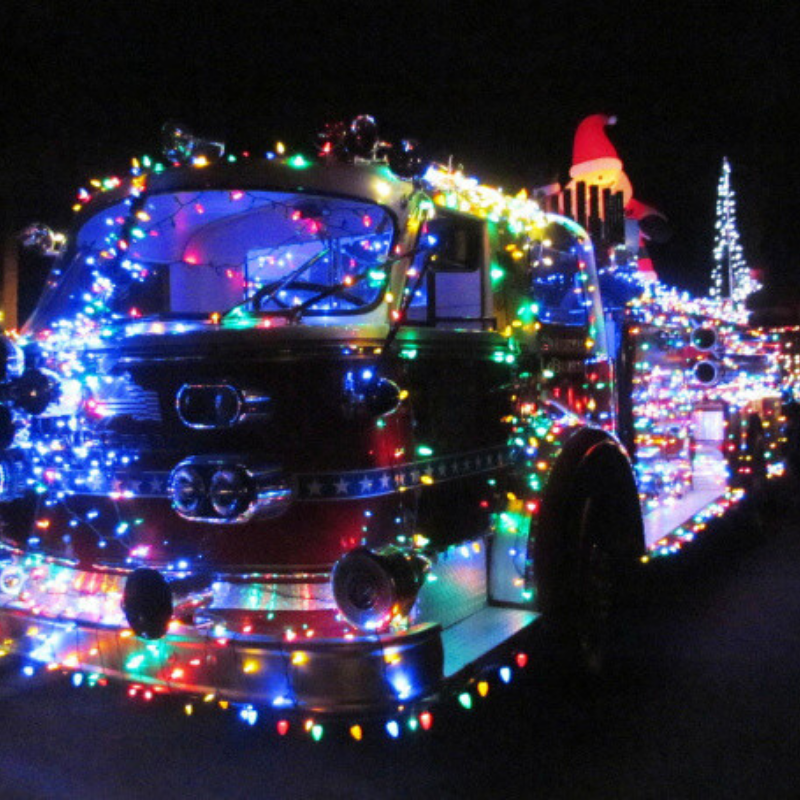 Photo of fire truck with Christmas lights on it